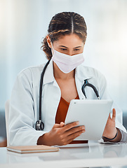 Image showing Covid, doctor and woman with tablet working on covid 19, corona virus or medical healthcare research for pandemic solution. Digital mobile tech, telehealth and hospital employee with safety face mask