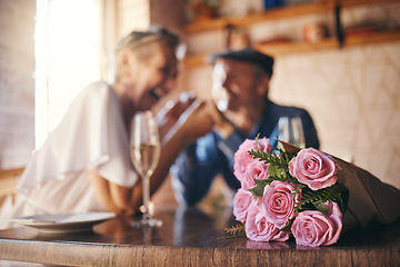 Image showing Love, celebration and of roses for couple marriage anniversary with champagne for toast. Romantic, happy and caring senior people in relationship commitment together enjoy intimate date.