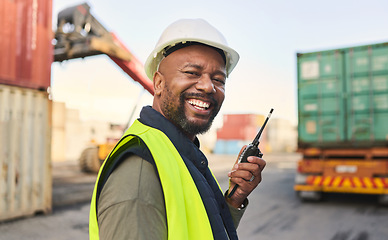 Image showing Logistics, communication and black man talking on walkie talkie while working at a storage port with container. Portrait of an African manufacturing manager speaking on tech while shipping cargo