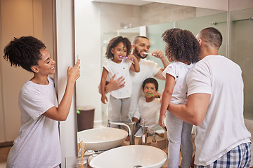 Image showing Father teaching kids to brush teeth in bathroom, happy mom photograph children learn dental health and morning in miami home. Parents clean mouth, personal hygiene and photo of family check mirror