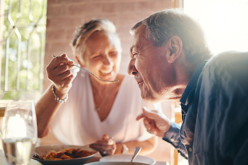 Image showing Couple, love and food with a senior man and woman on a date in a restaurant while eating on holiday. Travel, romance and dating with an elderly male and female pensioner enjoying a meal together