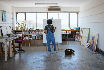 Image showing Painting, canvas and creative black woman artist in studio workshop inspiration for oil or watercolor design. Creativity, drawing or sketch painter student girl with project idea on easel in New York