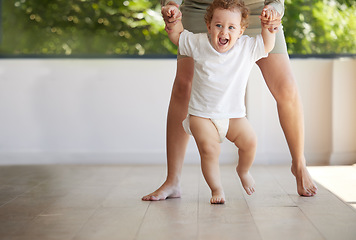 Image showing Baby boy, learning and walking with mom in support, first steps and healthy body development for children. Mother holding hands in teaching excited, smile and happy young kid balance, care and growth