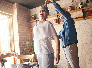 Image showing Love, happy family and dance with elderly couple celebrating and dancing to music in their home together. Wellness, stress relief and freedom by active seniors bonding and being playful and romantic