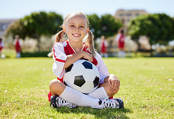 Image showing Soccer ball, sports girl and field sitting, training for youth competition match playing at stadium grass. Portrait, young athlete or player enjoy youth football world cup championship game at club