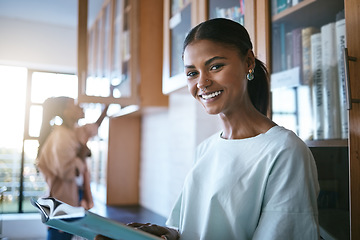 Image showing Notebook, reading and portrait of student in the library at university. Studying, education and young girl from India at college with textbook. Learning, knowledge and study in quiet space with books