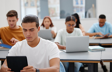 Image showing University, students and learning with laptop or tablet for digital notes in education auditorium. Concentration, focus and dedication of college people in classroom typing lesson memo and guidance.