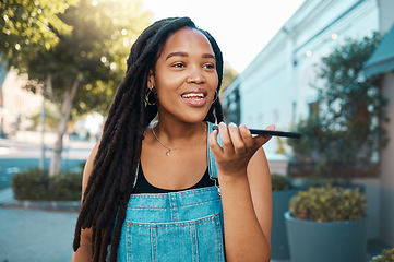 Image showing Black woman, speaker phone call and voice speech on microphone in Jamaica city street outdoor. Young millennial urban girl smartphone talking, loud audio chat ai application and mobile mic connection