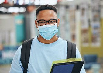 Image showing Compliance, education and corona rules in a library with male student browsing books for homework or assignment. University, safety and covid in campus study with portrait of learner practice safety