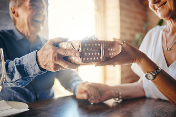 Image showing Box, love and senior couple with a gift exchange in celebration of a romantic and happy marriage anniversary. Smile, romance and married man giving an elderly wife a surprise present to celebrate her