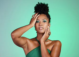 Image showing Fashion model in studio, black woman on green background in Brazil and beauty makeup portrait on confident skin. Afro hair on modern african girl, elegant pose with ring jewelry and cosmetic lipstick
