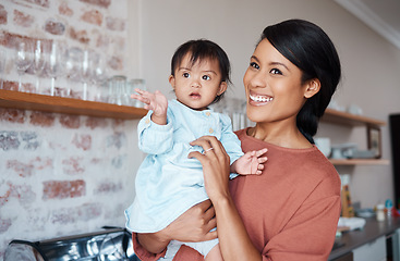 Image showing Disability, mother and baby with down syndrome in a happy and lovely family home with childcare on the weekend. Mom and disabled girl with special needs enjoy quality time, bonding and development