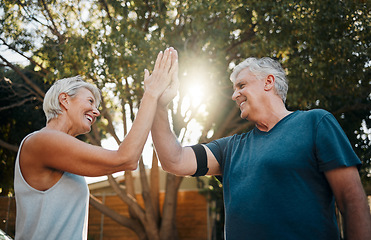 Image showing Fitness senior couple high five for support, teamwork and exercise motivation with sunshine, outdoor exercise and wellness. Success, achievement or target goal of elderly people for workout results