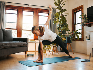 Image showing Woman, laptop streaming or home yoga class in relax stretching exercise or workout training in house living room lockdown. Mature person on technology fitness, zen pilates or health wellness tutorial