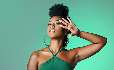 Image showing Beauty, fashion and empowerment with a beautiful black woman in studio of a green background for style. Makeup, cosmetics and trendy with an edgy female model posing for individuality and equality