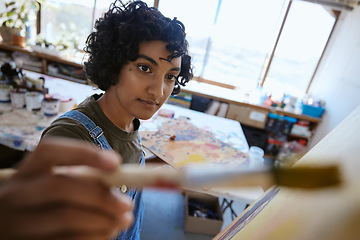 Image showing Painting, paintbrush and creative Indian woman artist in a workshop studio with creative, inspiration and design canvas. Young student painter in artwork process learning or professional career work