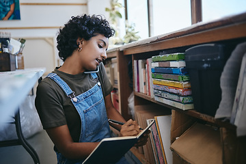 Image showing Art, writing and woman on a phone call in her studio taking notes in a book. Businesswoman on smartphone, checking paint supplies and artwork in her workshop. Artist startup business for art class