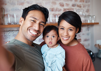 Image showing Happy asian family, smile for selfie in relax, love and care in happiness together at home. Portrait of a father, mother and Down syndrome baby smiling for photo in loving relationship