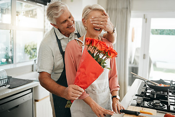 Image showing Senior couple, covering eyes and flowers surprise as man give wife bouquet of roses on an anniversary, birthday or valentines day in kitchen. Happy old man and woman being romantic in Australia house