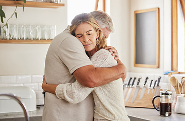 Image showing Couple, elderly and hug in kitchen in home together, romance and love. Care, man and woman in retirement love, marriage and embrace in sad moment for support, comfort and unity as married people