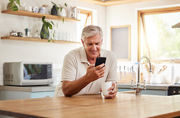 Image showing Phone, kitchen and senior relax man doing internet, web or online search for meme, funny video or comedy. Retirement life, mobile and elderly person with coffee, tea and typing on social media app