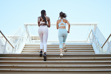 Image showing Fitness friends, running steps and women exercise together for healthy lifestyle, wellness and marathon workout in urban outdoors. Back of athletes, runner city training and cardio workout on stairs