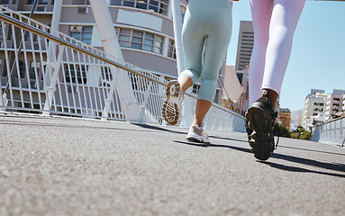 Image showing Women workout in city, fitness legs running shoes and step marathon motivation on Miami street. Friends training together in summer, outdoor urban road exercise and healthy strong cardio marathon