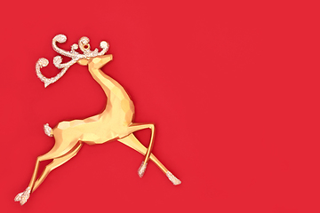 Image showing Christmas Eve Gold Reindeer on Red Background