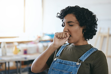 Image showing Tired, art and painter yawning while working on a creative project at a studio. Face of a black woman, artist or girl with burnout and stress from creativity, painting design or fatigue at a workshop