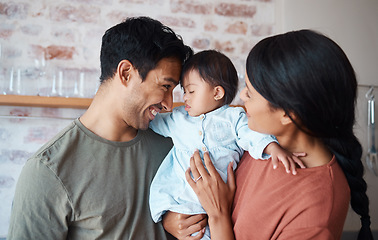 Image showing Happy family, down syndrome baby and love in home, bonding and caring for infant child. Support, care and parents, father and mother spending time together with newborn girl with disability in house.