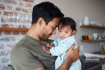 Image showing Baby, father and love while bonding and sharing a precious moment between infant girl and dad parent hugging and showing love, care and support at home. Happy man with cute child in their India house