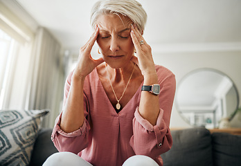 Image showing Headache pain, anxiety and senior woman thinking of mental health problem on the living room sofa in house. Sad elderly person with depression, home stress and frustrated with retirement on the couch