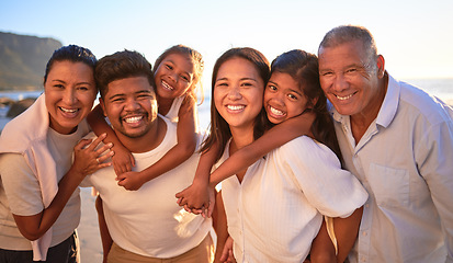 Image showing Portrait of happy family with children smile and hug together on a sunset beach. Adorable little kids bonding with mother, father, grandmother and grandfather outdoor on summer vacation at the ocean