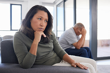 Image showing Senior couple stress after conflict, sad news or fight in living room of their home. Elderly man with woman in retirement avoid on sofa with divorce, frustrated, angry or depressed problem in house