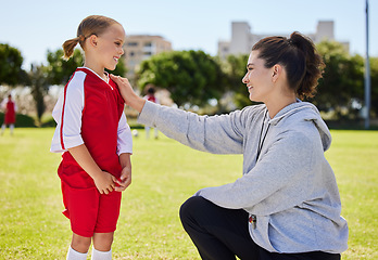 Image showing Girl, coach and soccer for motivation, inspiration and help on field for better performance in sport. Woman, child and football together on grass talking for advice, learning and guidance in game