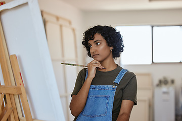 Image showing Paint, art and idea with a woman thinking about an artistic project in her design studio for creative expression. Painter, artistic and creativity with a painter doubt or confused in a workshop