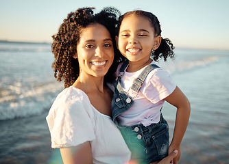 Image showing Family at beach for vacation, black mother and child play in the ocean. Sand, sun and ocean waves are great rest for mental health. Seaside holiday is fun for kids, parents and healthy stress relief