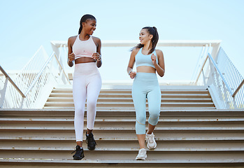 Image showing Fitness, health and exercise with personal trainer and woman workout on stairs, talking and bonding. Friends training and cardio workout by cheerful ladies enjoying healthy lifestyle and morning run