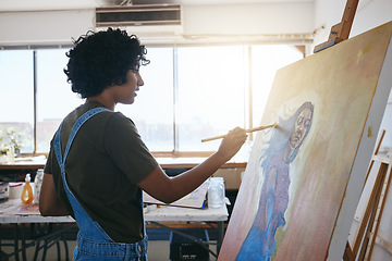 Image showing Artist painting on canvas in studio, creative workshop with oil color paint and young Indian woman with inspiration. Concentration on graphic artwork, professional painter with paintbrush to easel