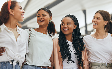 Image showing Happy international women, friends diversity and lifestyle conversation in fashion shopping mall. Group of gen z girls talking, college students smile together with happiness and community happiness
