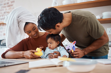 Image showing Down syndrome, family and parents with toys for child, education and learning home kitchen. Mom, dad and baby together at table for playing, teaching and cognitive development in house in New York