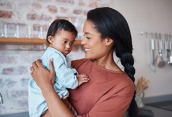 Image showing Disability baby and mother holding down syndrome child with love and care in home with acceptance. Puerto Rico family with young disabled kid and support of mom with cheerful smile embracing her.