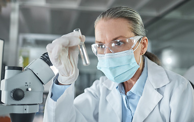 Image showing Covid lab, medical science and scientist working on futuristic medicine research for healthcare at a pharmacy. Doctor doing an expert chemical test on liquid for innovation while at a hospital