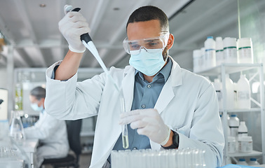 Image showing Covid, scientist man and vaccine research with medicine analysis test tube and chemical pipette in a science lab. Medical development, cure and an expert working on new virus cure in laboratory