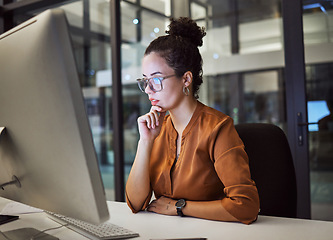 Image showing Woman, computer and office with glasses show reflection on face while working overtime. Girl, thinking and idea read analytics, email or communication online at work late at business in the night