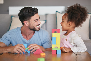 Image showing Children, family and education with a girl and her father playing with building blocks in the living room of their home. Love, learning and toys with a foster parent and adopted child together