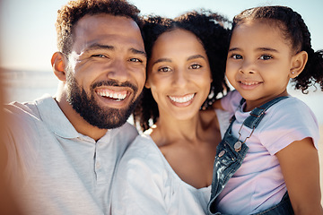 Image showing Happy, black family and smile for beach selfie in happiness together on a summer vacation in the outdoors. Portrait of a African man and woman holding little girl smiling for bonding love and care