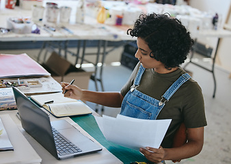 Image showing Laptop, art and documents with a woman writing in studio, workshop or showroom while working on museum management. Manager, creative or paperwork with India painter girl at work with idea research