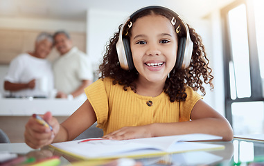 Image showing Girl portrait, homework and music for drawing, art and homeschool creative notebook, fun and education in family home. Happy child, studying and learning with headphones for audio listening at table