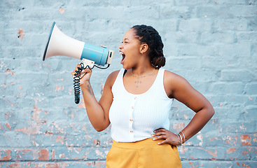 Image showing Black woman, megaphone speaker and announcement on wall background for speech, protest and angry voice. Feminist rally fight for human rights, justice and freedom, gender equality, society and news